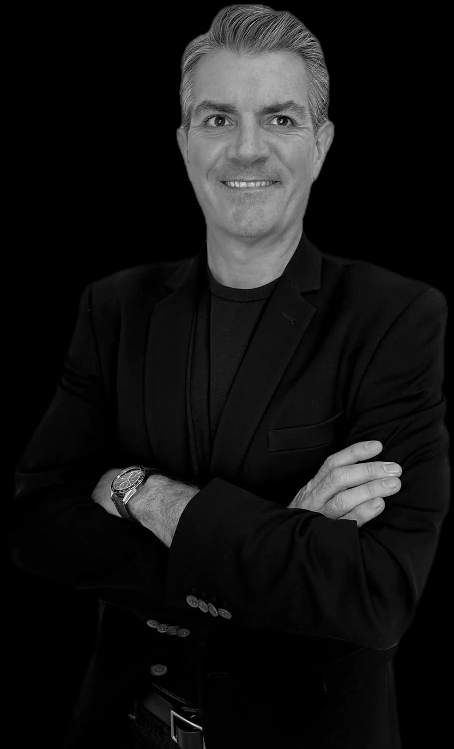 Portrait of Tom West, smiling, arms crossed