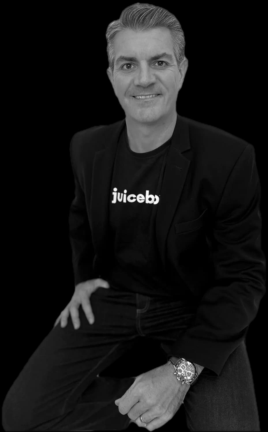 Tom West in a Juicebox t-shirt, smiling